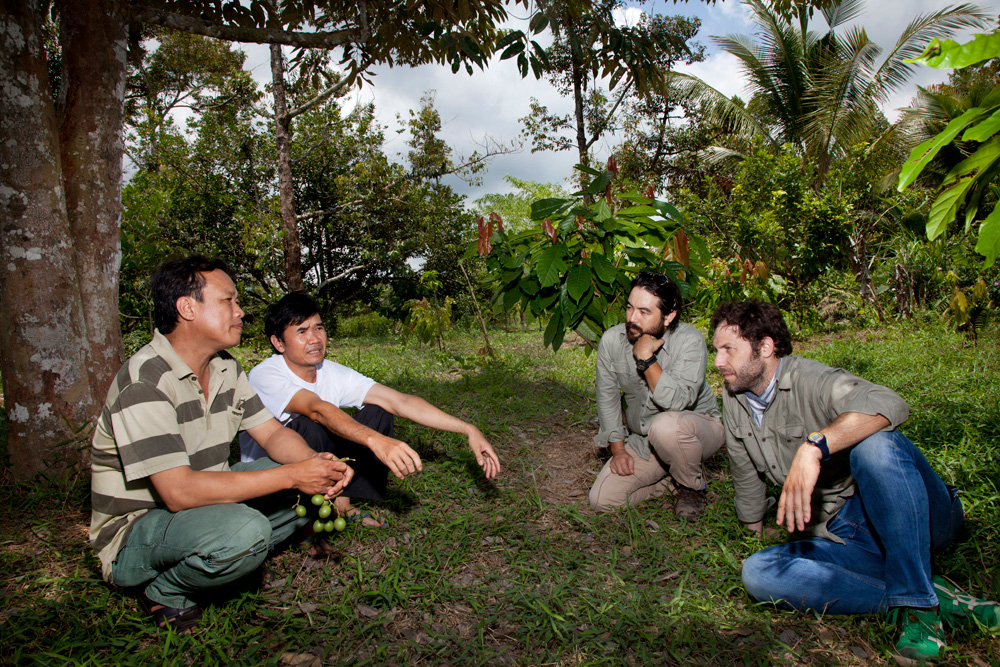 sam and vincent talking with cacao farmers marou chocolate